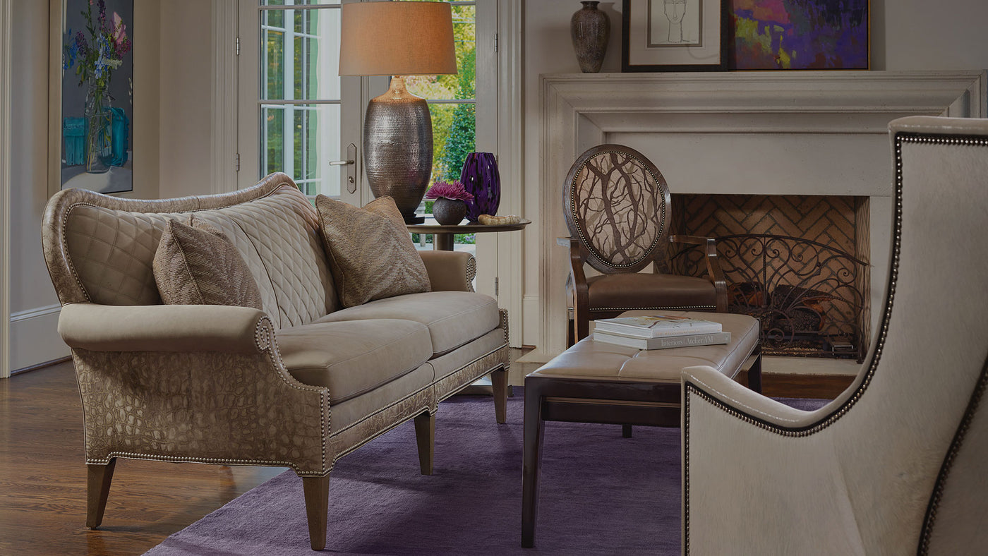 An inviting living room scene with a couch, chair, and fireplace, representing offerings from a Philadelphia furniture store.