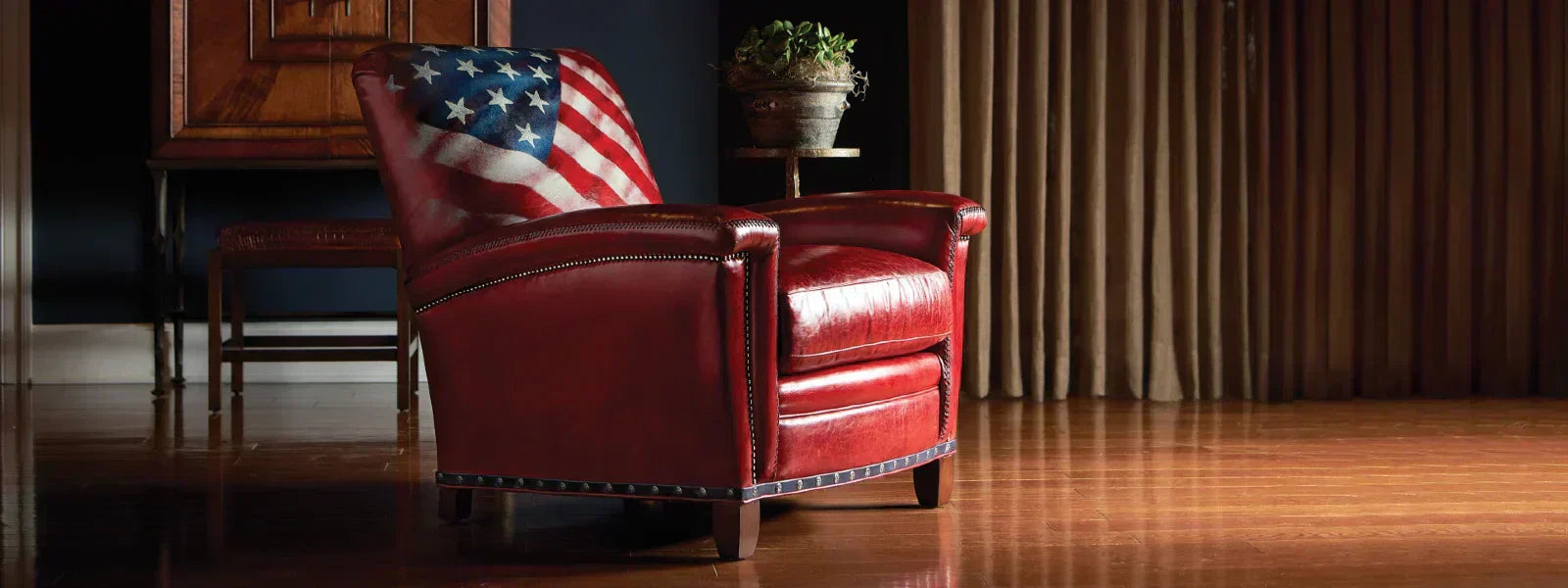 Red leather designer chair with American flag detail on the backrest, showcased in a stylish interior - designer chairs Berks County PA.